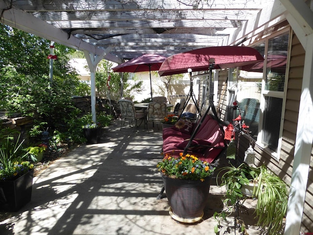 view of patio / terrace featuring outdoor dining area and a pergola
