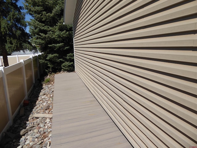 view of side of property featuring fence
