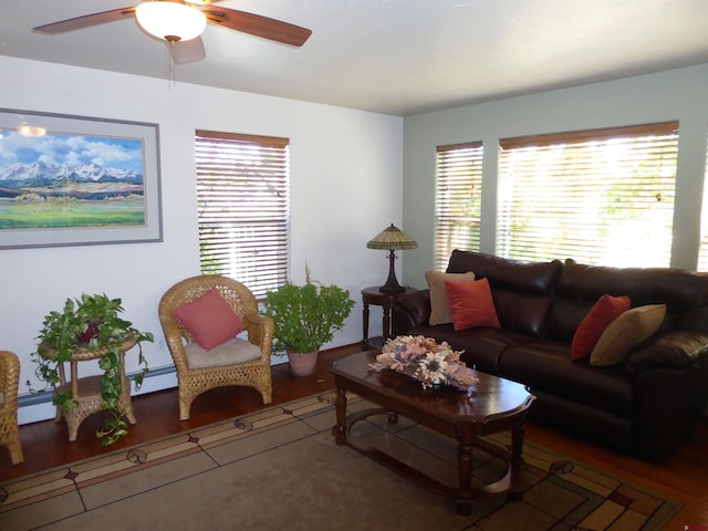 living area with ceiling fan and wood finished floors