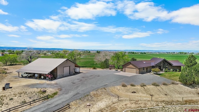 birds eye view of property with a rural view