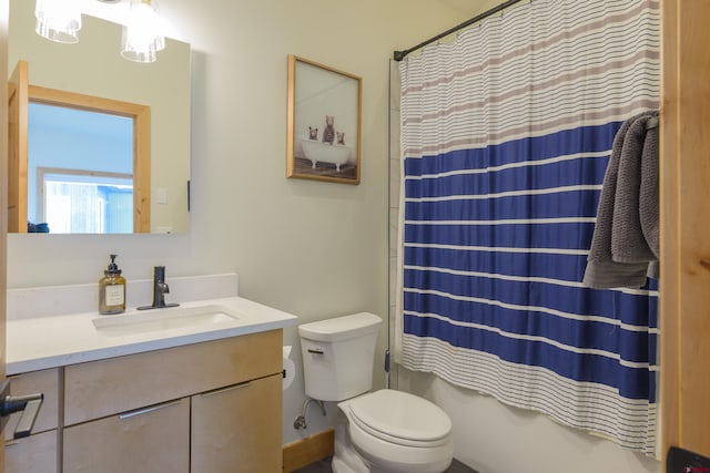 full bathroom featuring toilet, vanity, and shower / bath combo