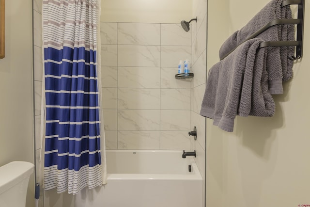 full bathroom featuring toilet and shower / bath combination with curtain