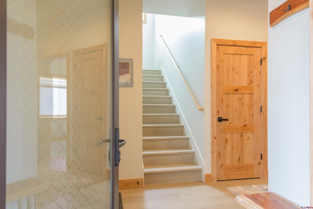 stairs with wood finished floors