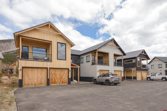 view of front of house with aphalt driveway and an attached garage