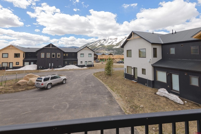 view of street with a mountain view and a residential view