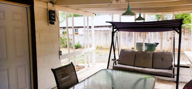 view of patio featuring outdoor lounge area and fence