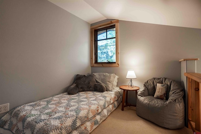 bedroom with light carpet and lofted ceiling