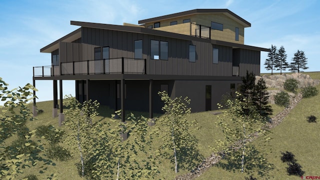 246 Anderson Dr, Crested Butte, CO 81224 - back of property with board and batten siding and a wooden deck