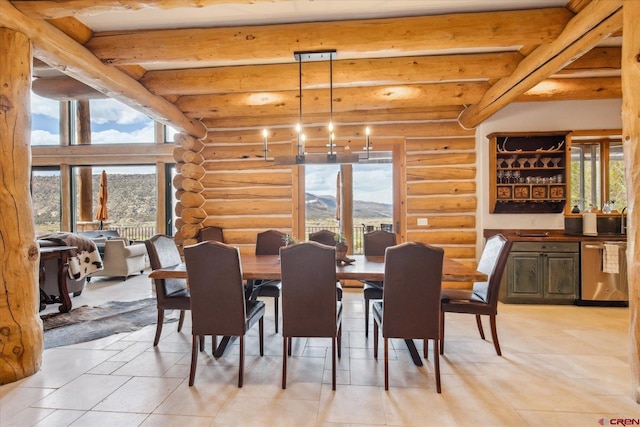 dining area featuring a mountain view, beamed ceiling, rustic walls, and light tile patterned floors