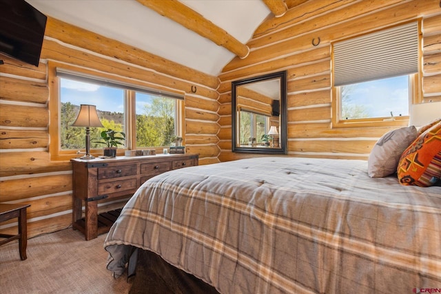 bedroom featuring rustic walls and vaulted ceiling with beams