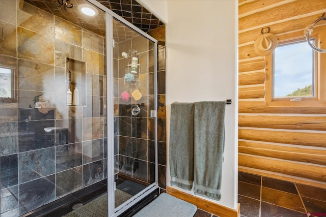 full bathroom featuring a stall shower, a healthy amount of sunlight, and rustic walls