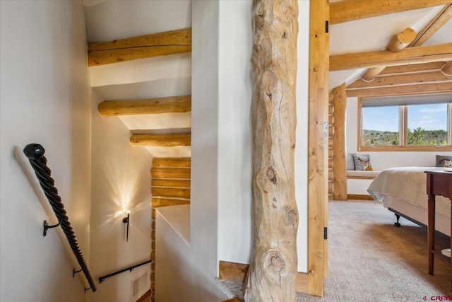 interior space with carpet flooring and log walls