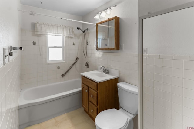 416 Howard St, Delta, CO 81416 - full bathroom featuring bathing tub / shower combination, tile walls, toilet, and vanity