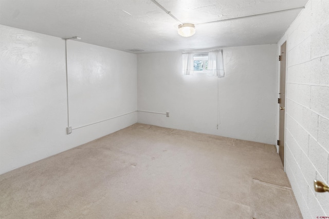 416 Howard St, Delta, CO 81416 - basement featuring carpet floors, visible vents, and concrete block wall
