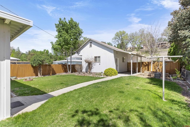 416 Howard St, Delta, CO 81416 - rear view of house featuring a fenced backyard, a patio area, and a yard