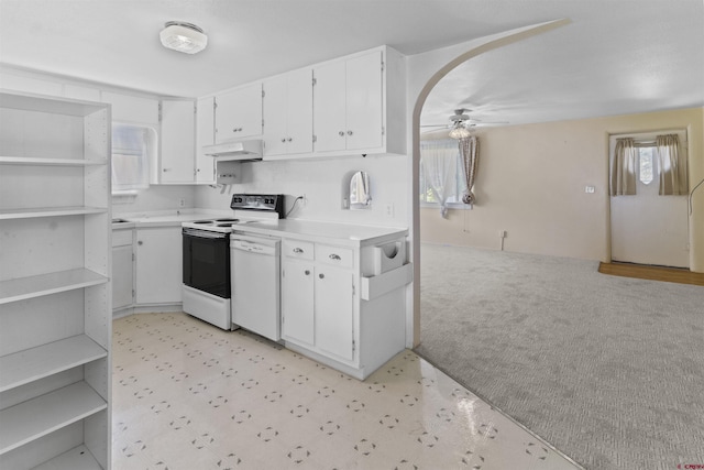 416 Howard St, Delta, CO 81416 - kitchen featuring a ceiling fan, a healthy amount of sunlight, electric stove, under cabinet range hood, and light countertops