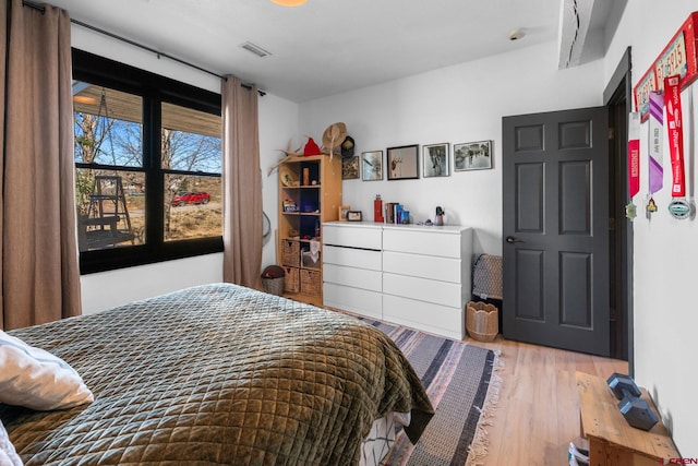 bedroom featuring wood finished floors