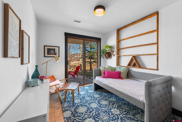 sitting room with tile patterned floors and visible vents