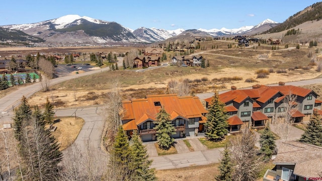 birds eye view of property with a mountain view and a residential view