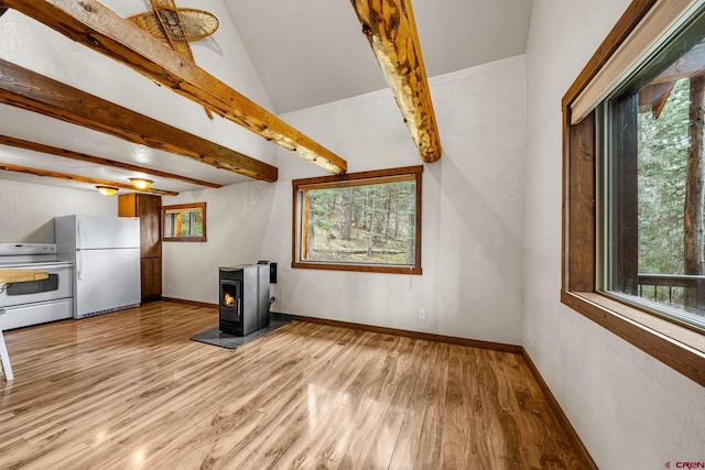 unfurnished living room featuring a healthy amount of sunlight and light wood-style flooring