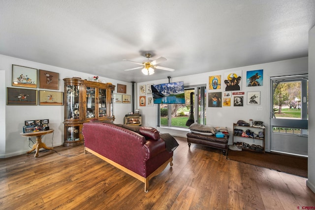 living room featuring ceiling fan and wood finished floors