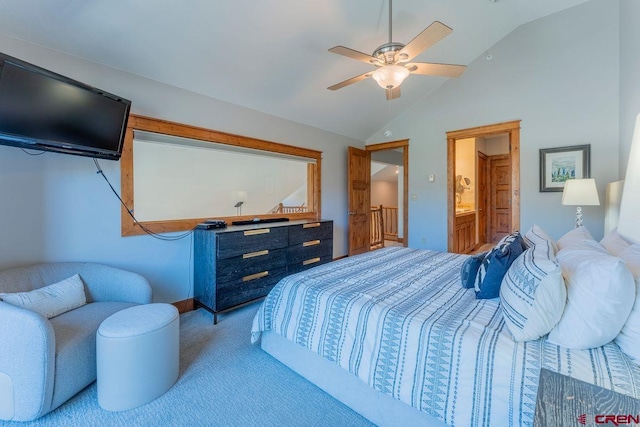carpeted bedroom with connected bathroom, ceiling fan, and vaulted ceiling