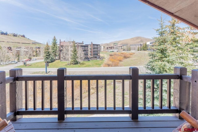 wooden deck with a mountain view
