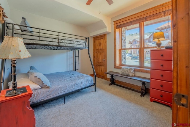 bedroom with baseboards, ceiling fan, and carpet floors