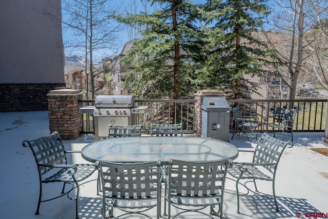 view of patio / terrace with area for grilling and outdoor dining area