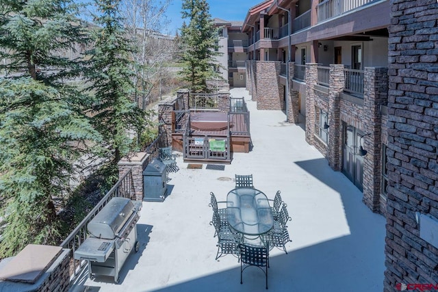 view of community featuring a patio and outdoor dining area