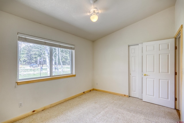 369 Beaver Cir, Pagosa Springs, CO 81147 - carpeted spare room with vaulted ceiling and baseboards