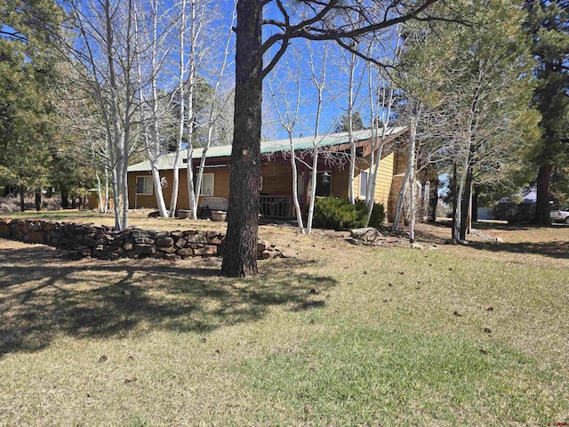 369 Beaver Cir, Pagosa Springs, CO 81147 - view of front of home with a front yard and covered porch