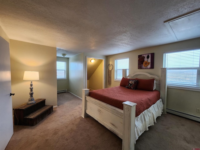 carpeted bedroom featuring baseboard heating, attic access, a textured ceiling, a baseboard heating unit, and baseboards