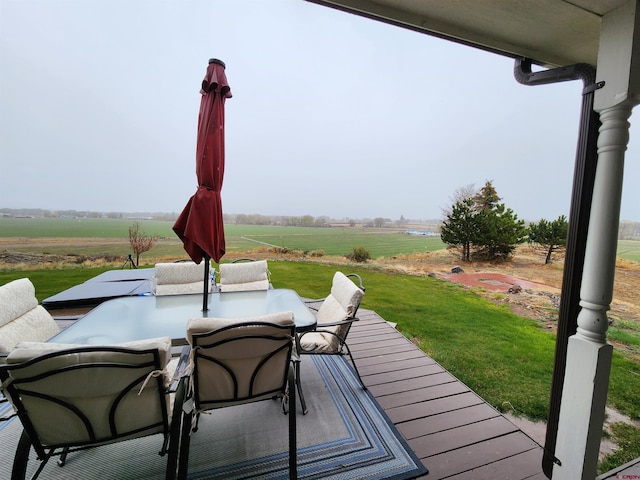 view of patio / terrace with a rural view and outdoor dining space