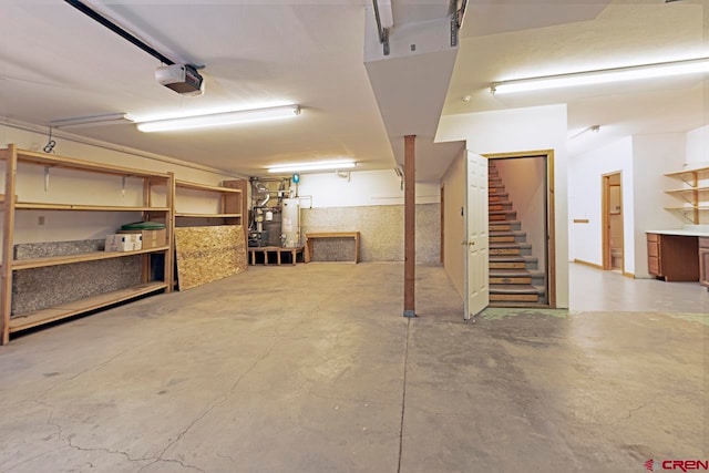 basement with stairway and gas water heater