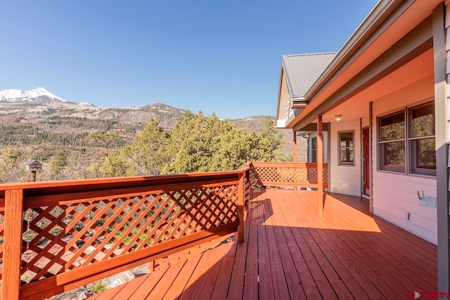 wooden terrace featuring a mountain view
