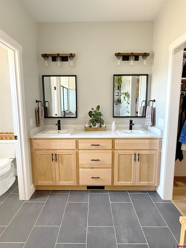 710 SE Pine St, Cedaredge, CO 81413 - full bath with tile patterned floors, toilet, and double vanity