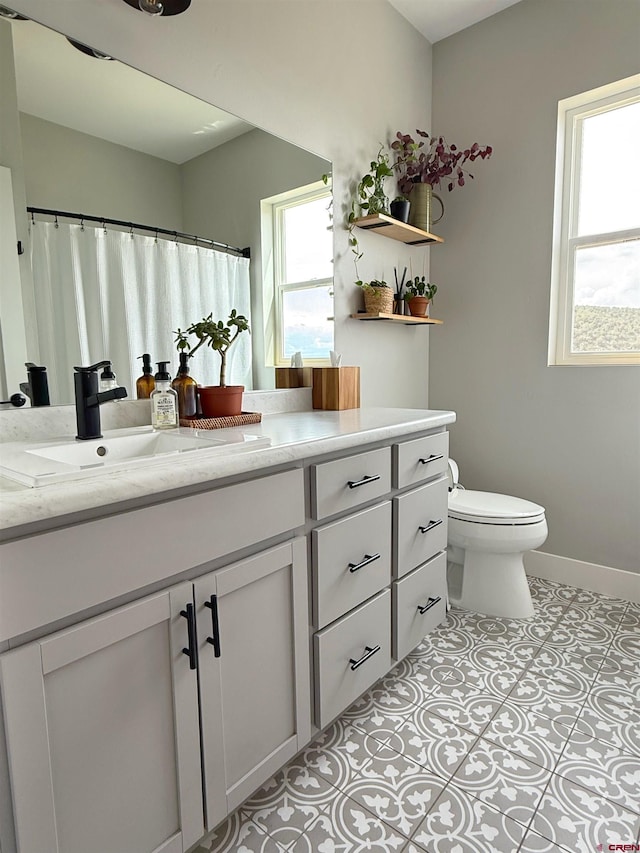 710 SE Pine St, Cedaredge, CO 81413 - full bath with vanity, toilet, and baseboards