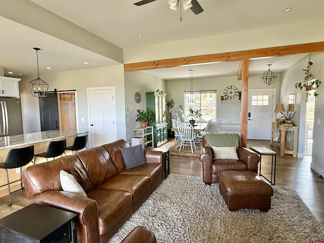 710 SE Pine St, Cedaredge, CO 81413 - living room featuring wood finished floors, a ceiling fan, recessed lighting, baseboards, and beam ceiling