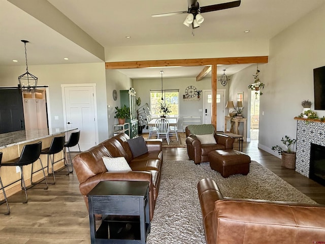 710 SE Pine St, Cedaredge, CO 81413 - living room with wood finished floors, a ceiling fan, recessed lighting, beamed ceiling, and baseboards