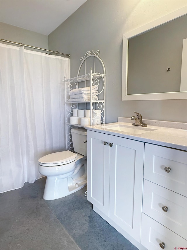 710 SE Pine St, Cedaredge, CO 81413 - full bath featuring toilet, vanity, concrete floors, and a shower with curtain