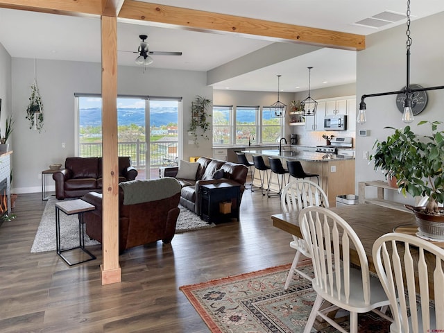 710 SE Pine St, Cedaredge, CO 81413 - dining area with ceiling fan, dark wood finished floors, recessed lighting, and baseboards