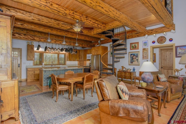dining area featuring stairway, a ceiling fan, wooden ceiling, and beamed ceiling