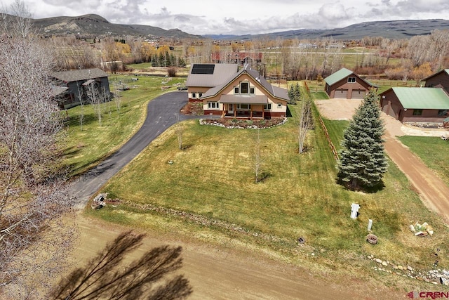 view from above of property with a mountain backdrop