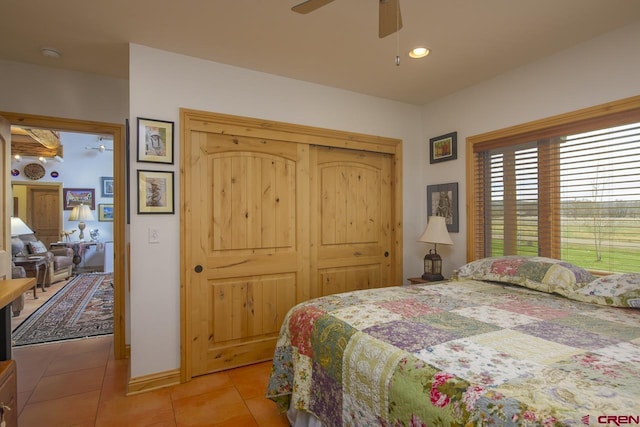 bedroom with light tile patterned flooring, a closet, a ceiling fan, and recessed lighting