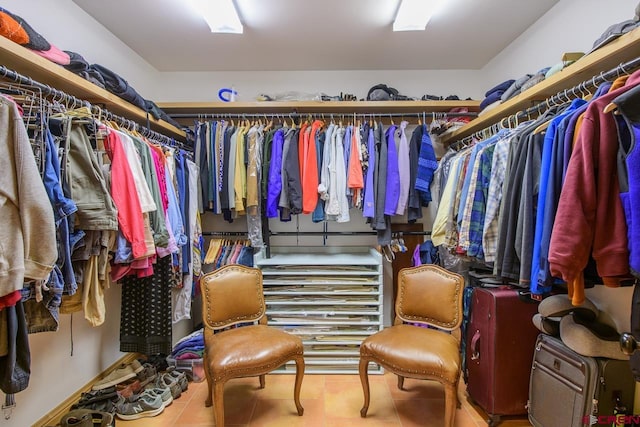 spacious closet featuring tile patterned floors