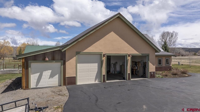 garage with fence