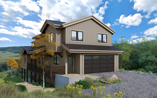 view of front of property featuring a standing seam roof, metal roof, and a garage