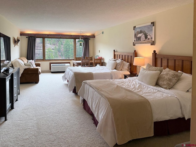 314 N Tamarron Dr Unit 313, Durango, CO 81301 - bedroom featuring carpet flooring and a textured ceiling