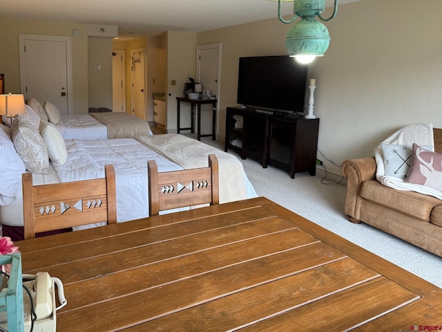 314 N Tamarron Dr Unit 313, Durango, CO 81301 - living room featuring light colored carpet